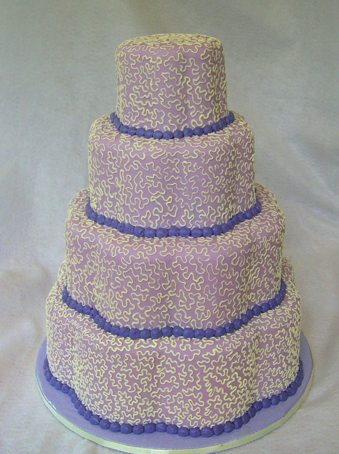 Lilac string work wedding cake